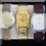 J03. Gold watch and Bulove and Skagen watches. 